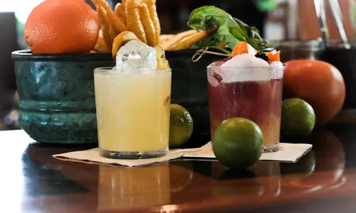 Cocktails with fruit around them