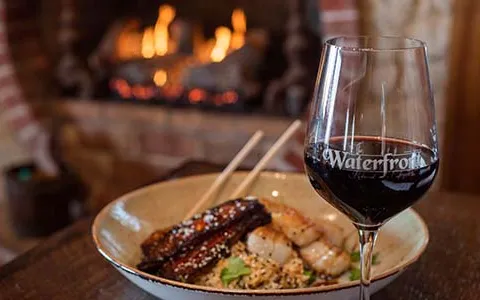 Red Wine Glass with Scallops in Background