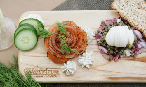 House Cold Smoked Salmon Appetizer with Bread Wafers and Egg